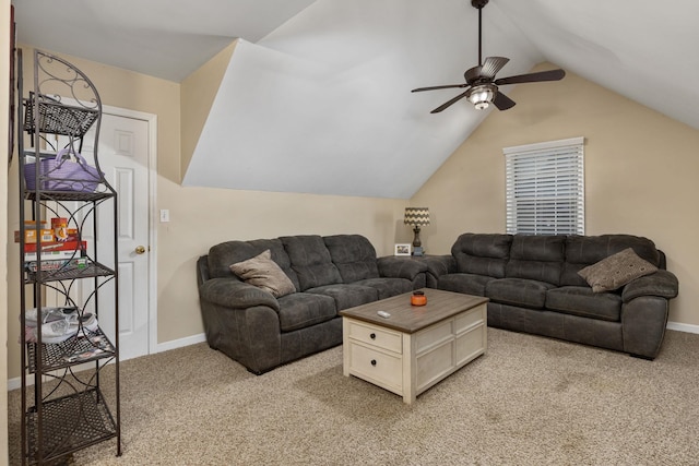 living area featuring light carpet, baseboards, and lofted ceiling