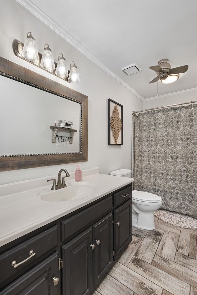 full bath featuring a shower with shower curtain, toilet, ornamental molding, a ceiling fan, and vanity