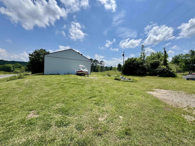  - view of yard with an outbuilding and a rural view