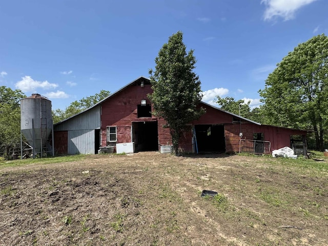  - view of side of home featuring an outbuilding and a pole building