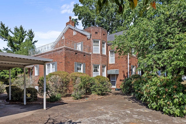 exterior space featuring a carport