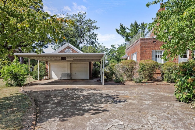 exterior space with a carport and a garage