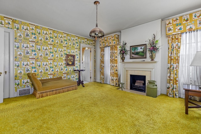 unfurnished room with a tiled fireplace and carpet floors