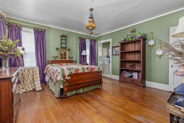 bedroom with ensuite bathroom, wood-type flooring, and ornamental molding