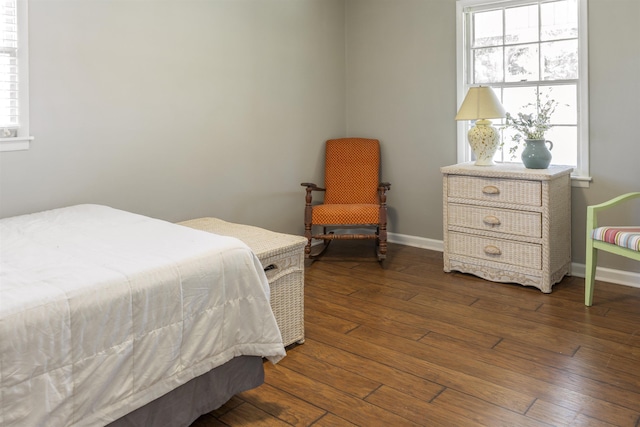  - bedroom featuring dark wood-style flooring and baseboards