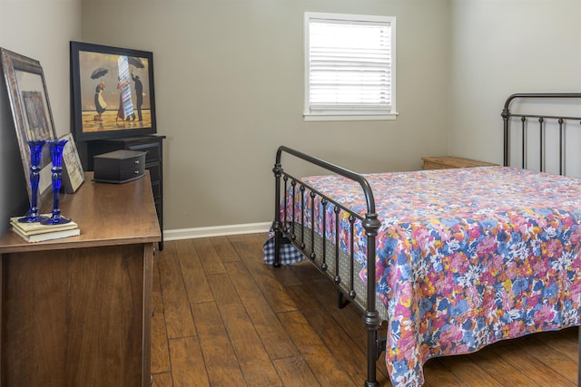  - bedroom with baseboards and dark wood-style floors