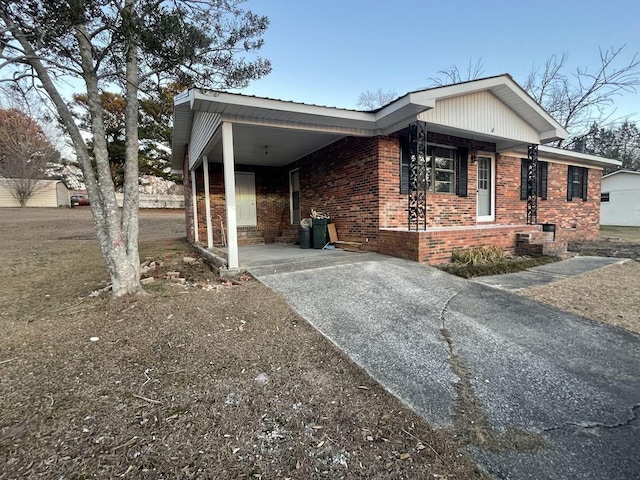 view of front of home with a carport