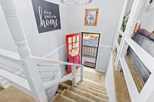 stairs featuring tile patterned floors