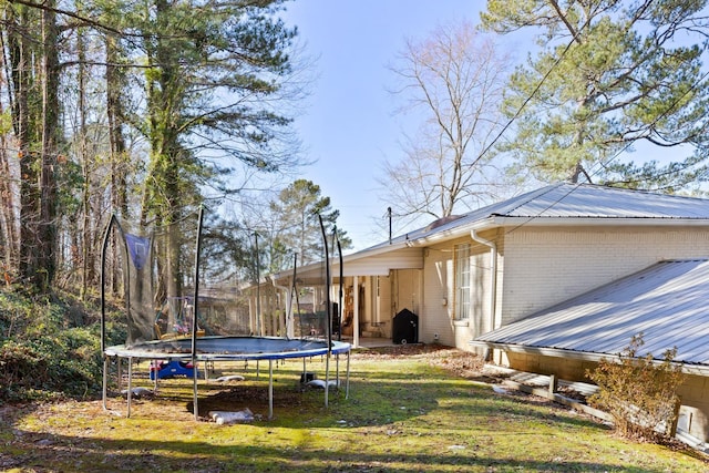 view of yard featuring a trampoline