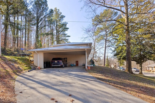 exterior space with a carport