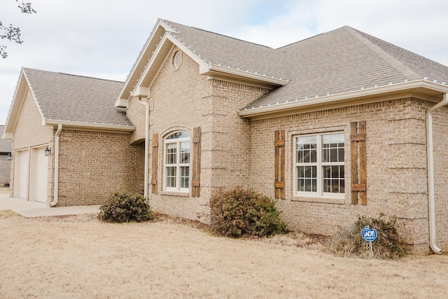 view of property exterior featuring a garage