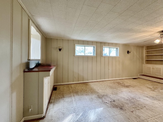  - unfurnished room featuring a ceiling fan