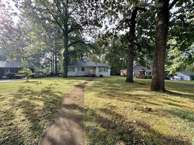  - ranch-style home featuring a front yard