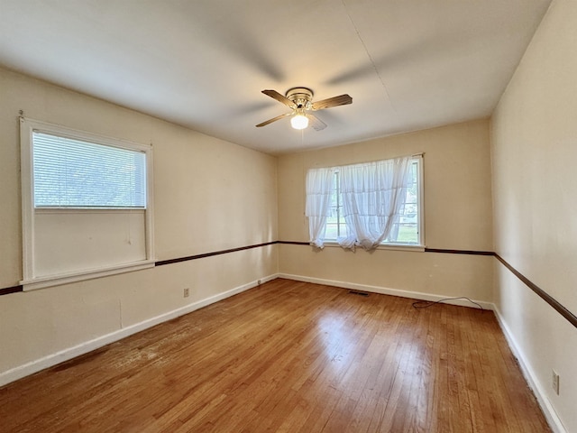  - unfurnished room featuring wood finished floors and ceiling fan