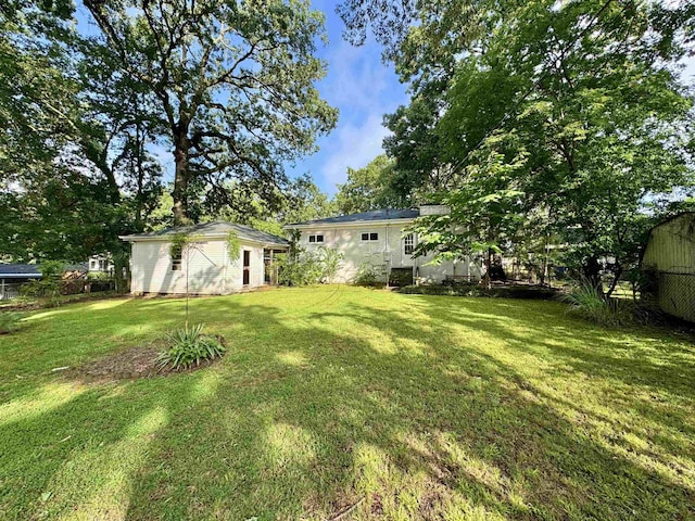  - view of yard with an outbuilding