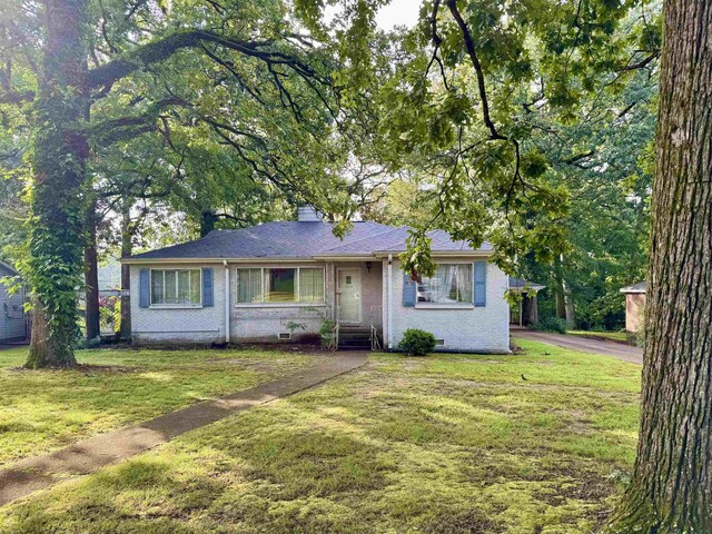  - view of front of property with a front lawn, brick siding, and a chimney