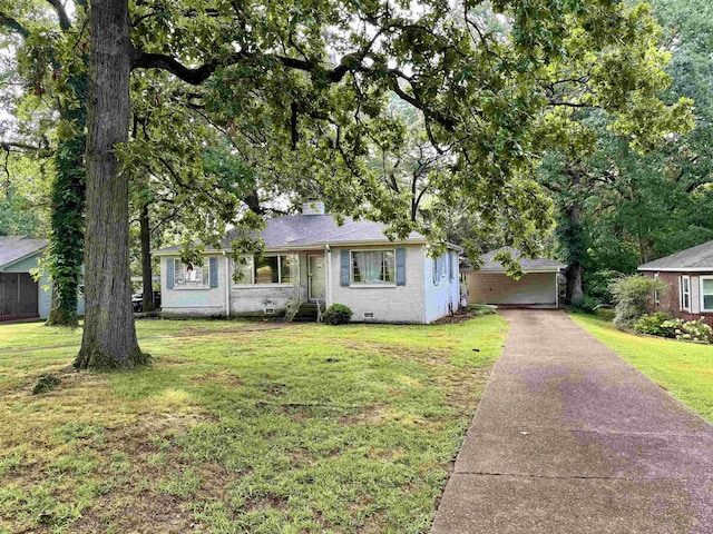  - view of front of home featuring a front lawn, brick siding, crawl space, and a garage