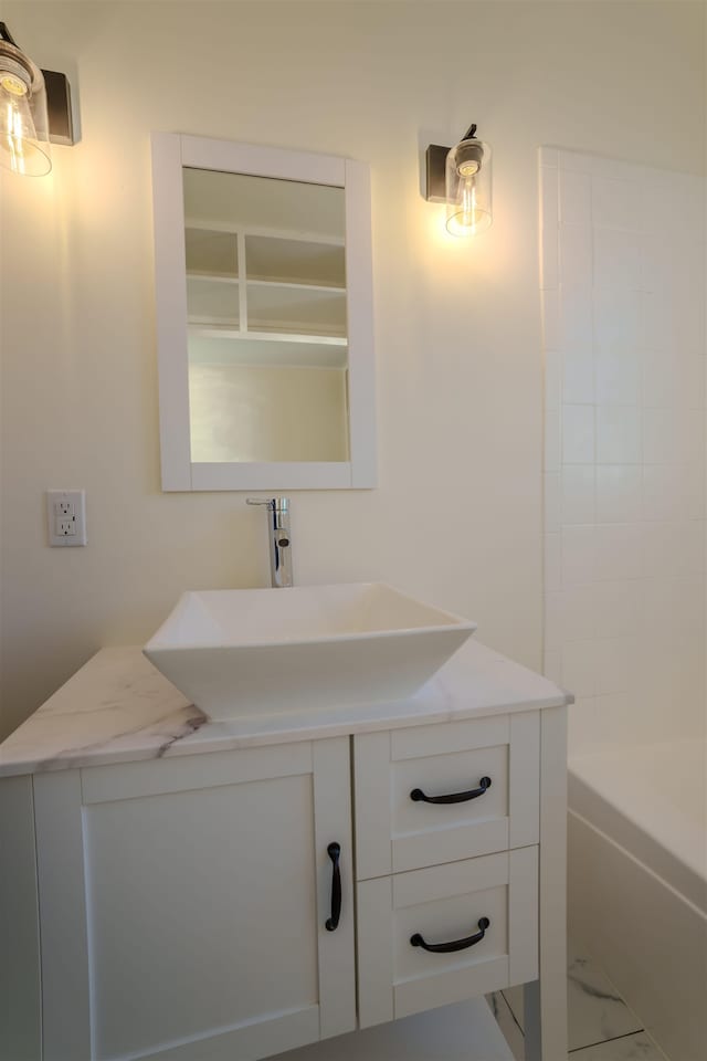  - full bathroom featuring vanity, marble finish floors, and bathtub / shower combination