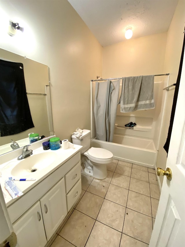 full bath with toilet, vanity, tile patterned floors, a textured ceiling, and shower / bathtub combination with curtain