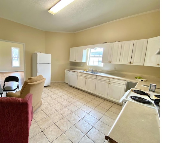 kitchen featuring light countertops, light tile patterned floors, white appliances, white cabinetry, and a sink