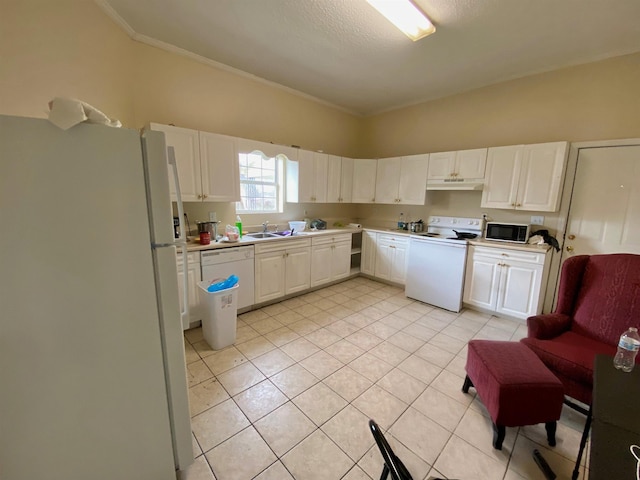 kitchen featuring white appliances, light tile patterned floors, light countertops, under cabinet range hood, and white cabinetry