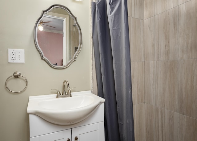  - full bathroom with tiled shower and vanity