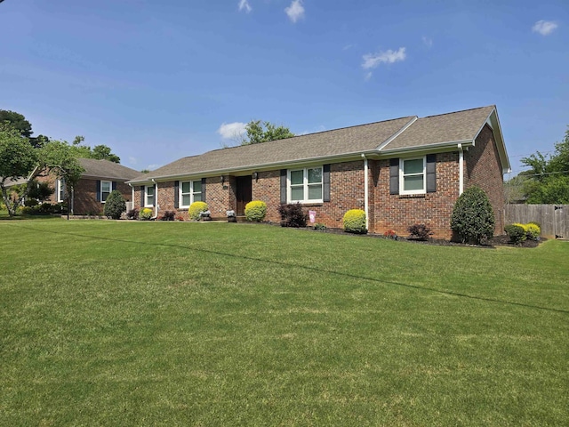  - ranch-style house featuring brick siding and a shingled roof
