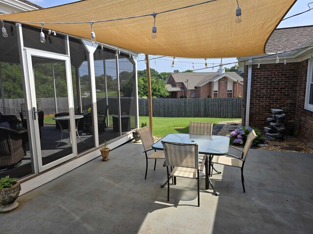  - fenced backyard with outdoor dining space and a patio
