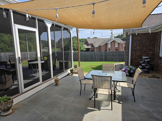  - fenced backyard featuring a patio area and outdoor dining area