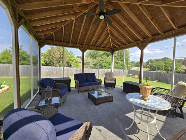  - sunroom / solarium featuring vaulted ceiling, an outdoor living space, and ceiling fan