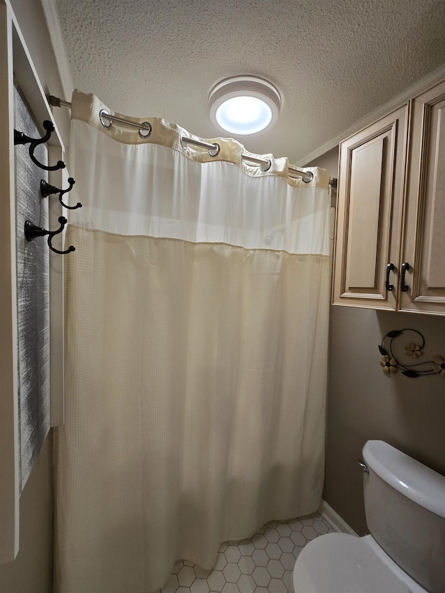  - full bathroom with a textured ceiling, tile patterned flooring, and curtained shower