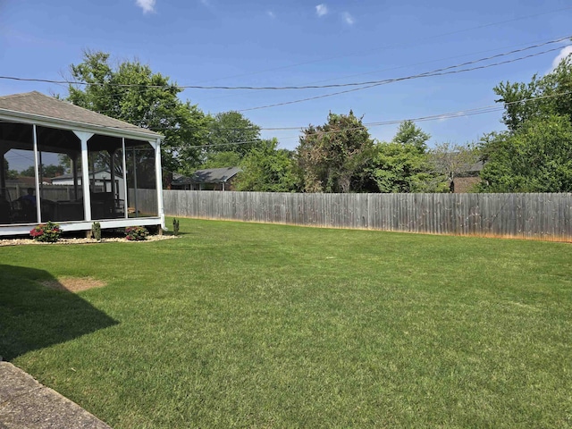 - fenced backyard featuring a sunroom