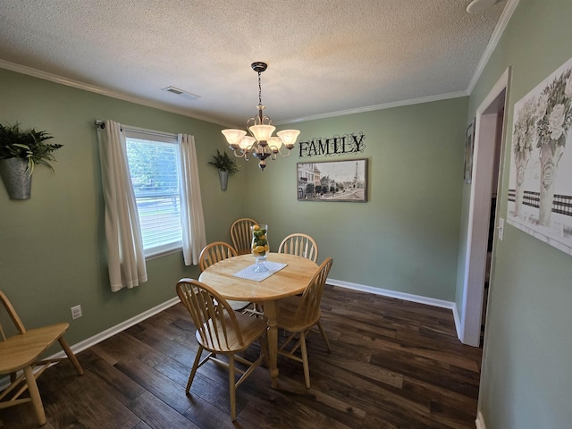  - dining area with a chandelier, crown molding, dark wood finished floors, and a textured ceiling