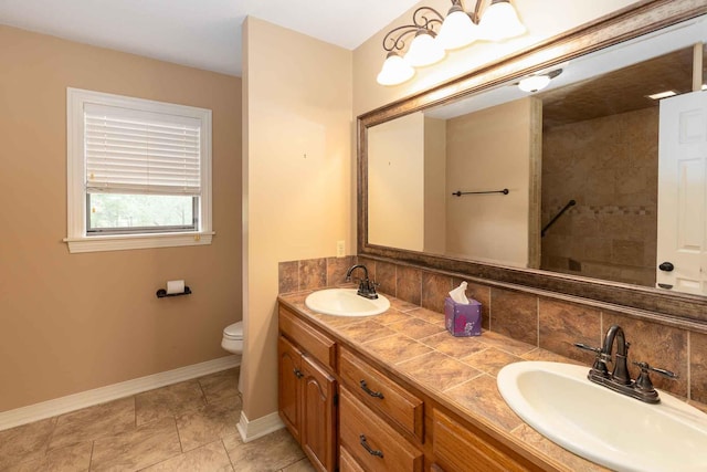 full bathroom with backsplash, baseboards, and a sink