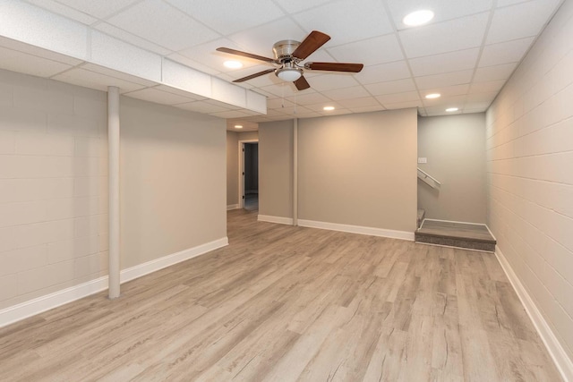 finished below grade area featuring baseboards, a ceiling fan, light wood-style floors, and recessed lighting