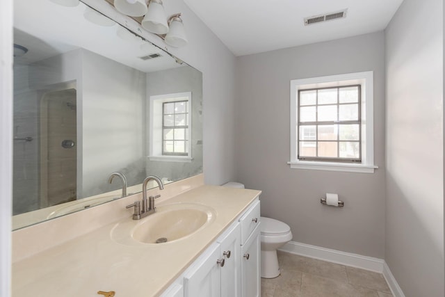 full bath featuring baseboards, toilet, visible vents, and a stall shower