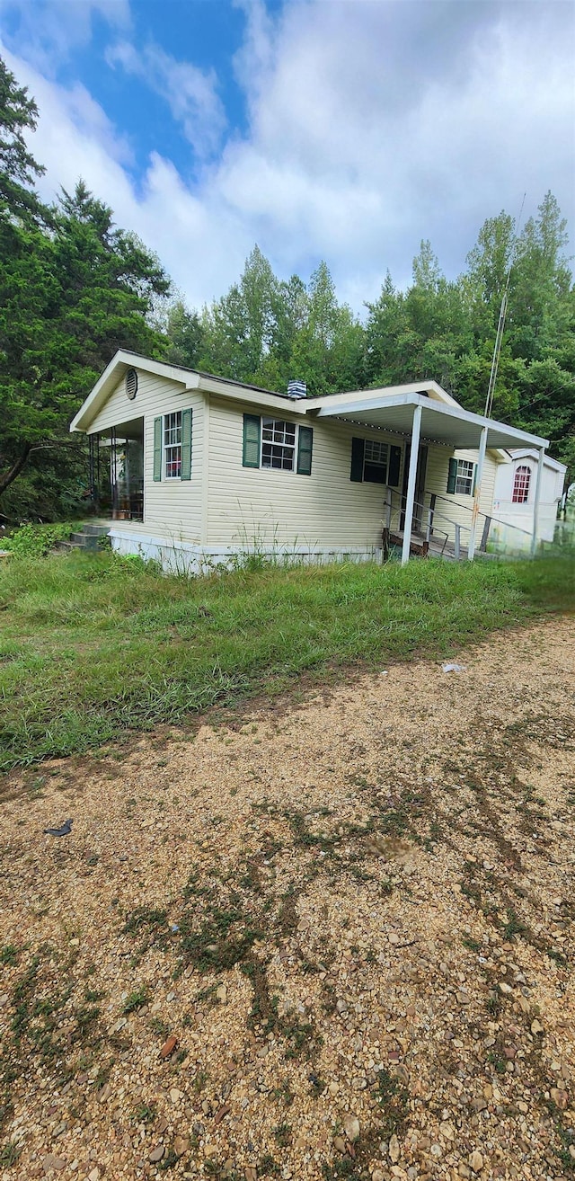 view of front of house with a carport