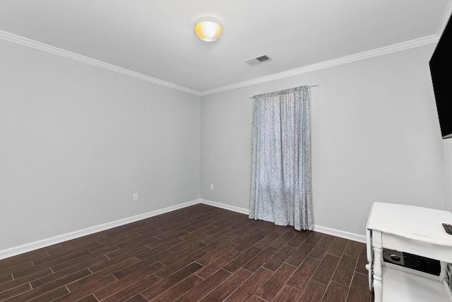 unfurnished room with crown molding