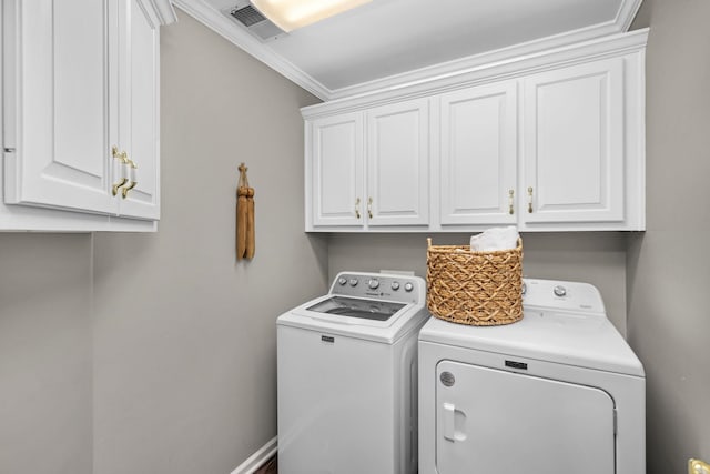 laundry area with cabinets, independent washer and dryer, and crown molding