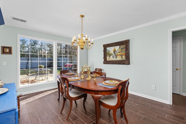 dining room with ornamental molding, a chandelier, and plenty of natural light