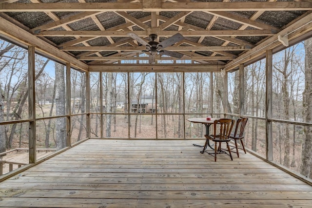 unfurnished sunroom featuring ceiling fan