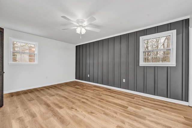 empty room featuring ceiling fan and light wood-type flooring