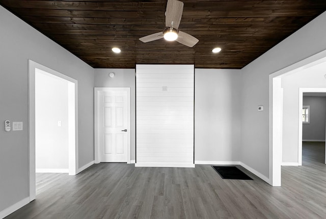 unfurnished bedroom featuring hardwood / wood-style flooring, ceiling fan, and wood ceiling