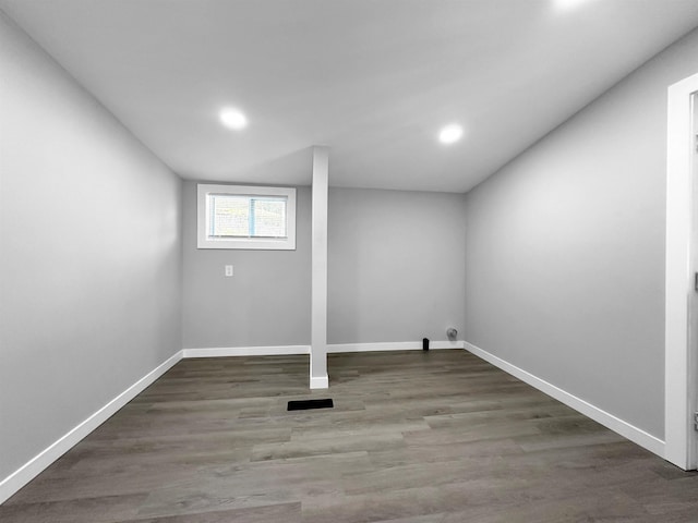 laundry room with dark hardwood / wood-style flooring