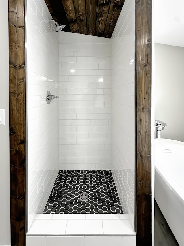 bathroom with a tile shower