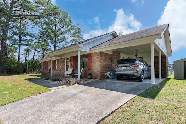 ranch-style house featuring covered porch, a front lawn, and a carport