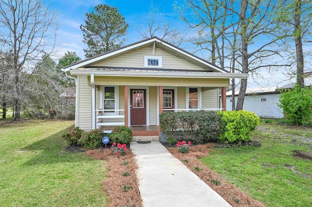 view of front of house featuring a porch and a front lawn