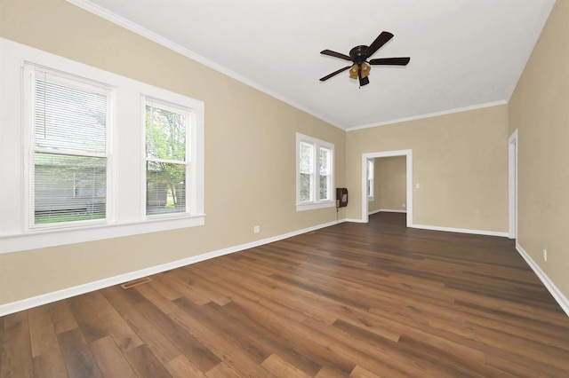 unfurnished room featuring baseboards, crown molding, ceiling fan, and dark wood-type flooring