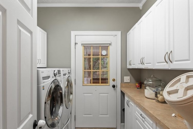 laundry room with cabinets, ornamental molding, and independent washer and dryer