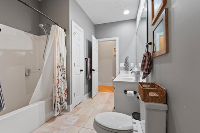 full bathroom with vanity, shower / tub combo with curtain, tile patterned floors, and toilet